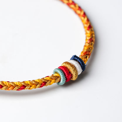 Protection and Luck – Handwoven Red String with Tibetan Dorje knot