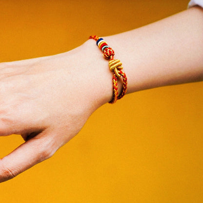 Protection and Luck – Handwoven Red String with Tibetan Dorje knot