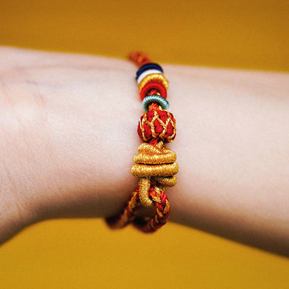 Protection and Luck – Handwoven Red String with Tibetan Dorje knot